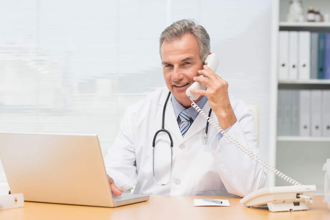 doctor on the phone providing medical answering services